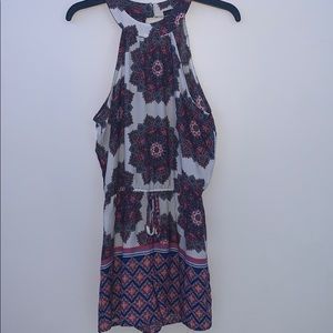 White,pink,some purple and blue medium size romper